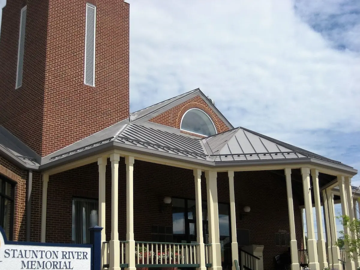 Skilled roofing craftsmen working on a residential roof in Riversville